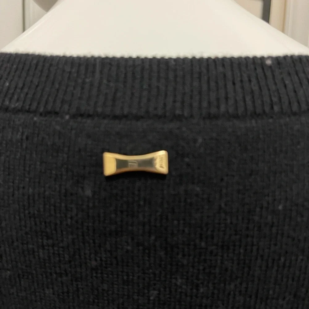 Kate spade black sweater. Looks like Front made with the unique sheep fur.